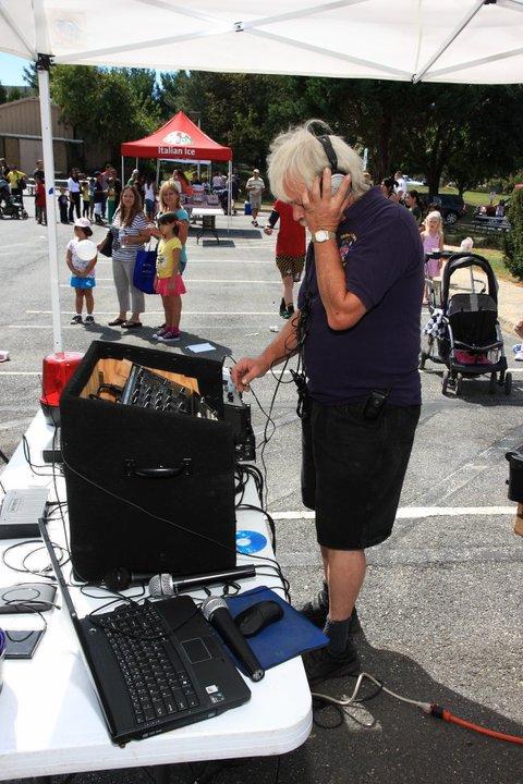 Our very own DJ SHakey Ray cues up the next song for the crowds.